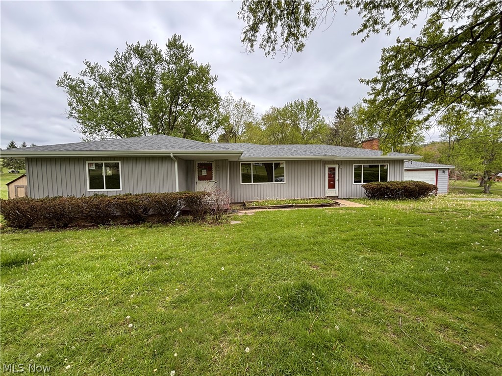 2–3 bedroom ranch situated on a 0.73-acre country lot, offering a great opportunity to add your personal touch while benefiting from extensive recent upgrades (2025–2026). Major improvements include connection to public sewer, new windows, new roof, soffit, fascia, gutters and downspouts, two new sump pumps, new hot water tank, and updated exterior electric with disconnect.
The home is ready for your finishing touches—bring your remodeling ideas and make it your own. The previous owner removed a wall between two bedrooms, creating flexible space that can easily be converted back to a third bedroom if desired.
The spacious main-level great room features a beautiful stone fireplace and provides access to a covered patio and fenced backyard—perfect for outdoor enjoyment. A detached two-car garage with a new roof adds additional convenience.
The expansive 1,800+ sq. ft. basement offers abundant storage and excellent potential for additional finished living space.