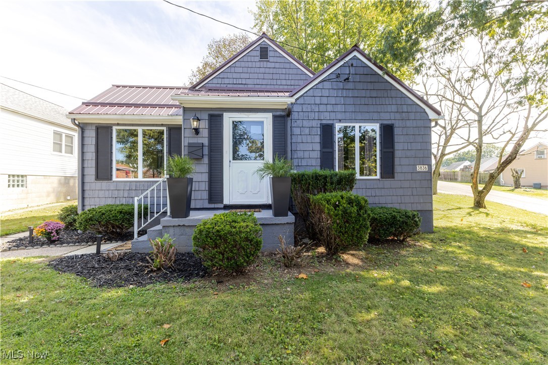 Don't miss this beautifully remodeled home on a spacious corner lot in the Marland Heights neighborhood! This home offers 3 bedrooms, 2 on the main level including a primary suite with its own bath and convenient laundry tucked into a closet (washer & dryer included!). Upstairs you'll find a nice sized bedroom with an oversized walk-through space perfect as a sitting room, playroom, or office. The bright and welcoming living room flows seamlessly into the dining area, while the updated kitchen boasts quartz countertops and stainless-steel appliances. All furniture is negotiable. The full basement provides excellent storage space. Step outside to enjoy the backyard and patio-ideal for entertaining or relaxing. The outdoor fireplace adds cozy ambiance for cool fall evenings, roasting marshmallows, or gathering with friends. The large corner lot is surrounded by beautiful trees, and the rear parking pad keeps vehicles off the street. Move-in ready and waiting for you!