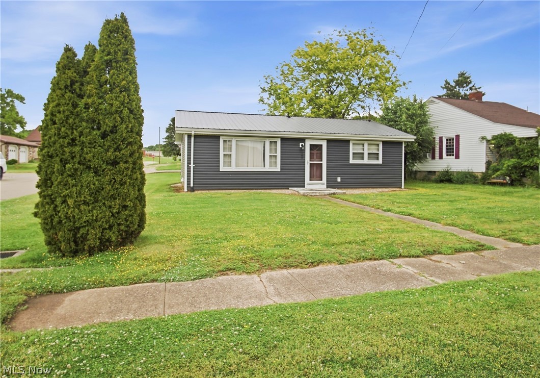 Don’t miss this charming 2 bedroom, 1 bath ranch home in the DunFalls Association of Duncan Falls, offering public water and public sewer! Located on a corner lot in the Franklin Local School District, this home is a great opportunity for a first-time buyer, investor, or someone looking to downsize. Enjoy the convenience of 1st floor laundry, a 2 car detached garage, and an enclosed back porch/sunroom overlooking the yard and offering additional space to enjoy. The kitchen appliances, washer/dryer, and large living room TV will remain. The furnace and HVAC were updated in 2014, the metal roof and siding on the home and garage were new in 2022, and the garage door was replaced in 2023. Newer vinyl flooring has been installed over hardwood floors.