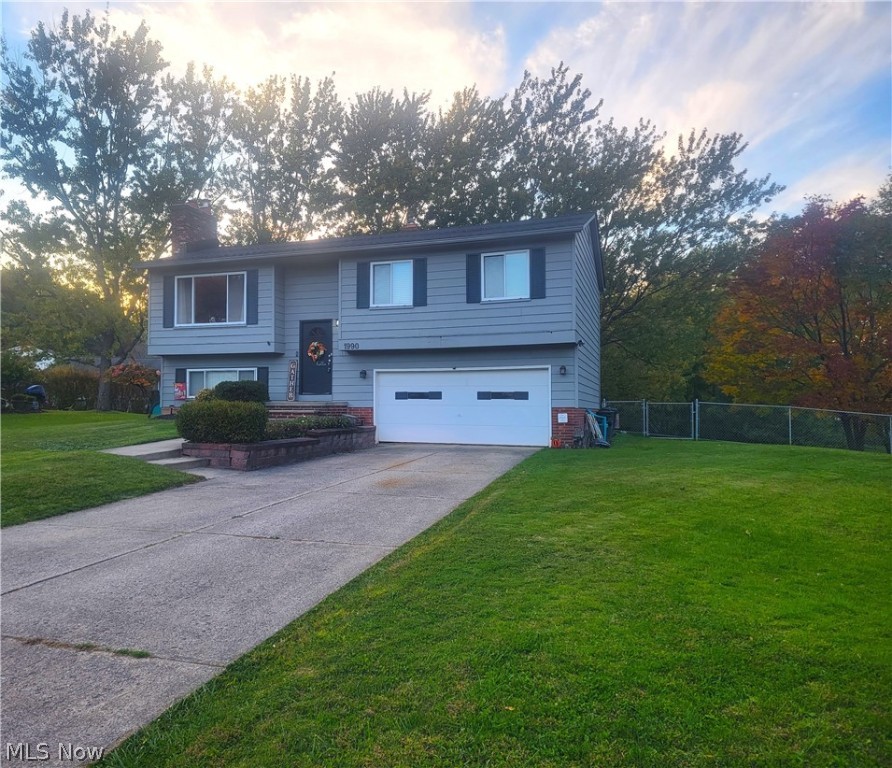 This lovely home is tucked at the end of a cul-de-sac and is ready for you to move right in! The main living area is great for entertaining. The dining room flows out to the deck that overlooks the generously sized and fenced-in yard. There is also a patio tucked nicely under the deck for even more outdoor seating.  There are two wood burning fireplaces- one on each floor. The Lower level hosts a living area, bar with tons of seating, half bath, and Laundry room off of the garage. Schedule your tour today! You don't want to miss this one!
