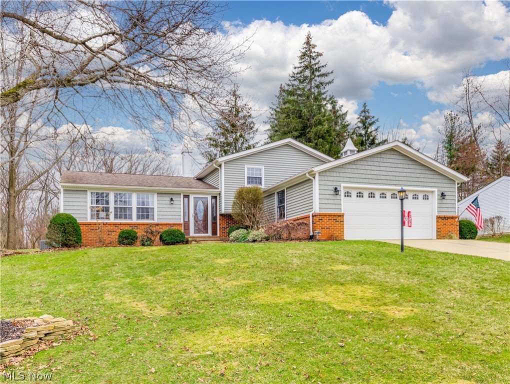 This four level split home has so much to offer! As you enter you will see the large, bright living room. It flows into the formal dining room and kitchen.  The eat in Kitchen has granite counter tops and stone back splash, a new barndoor, and the appliances are included. Ther are sliding doors to the screened in vaulted 3 season room. It is 16x15 and over looks your private backyard. The second level has 3 bedrooms and an updated full bath with double sinks. Closet organizers were added to the closets. The lower level features a family room with gas fireplace. There is a full bath on the lower level with a walk in shower. In the basement area is a 4th bedroom, laundry room and workshop area. There is an attached 2 car garage. Some updates include: New vinyl flooring 2021, new carpet 2021, Air conditioning 2020, Hot water tank 2018, Roof, siding, gutters 2013, Furnace 2012, Pella windows 1991, Appliances 2015 There is a shed for storage. This is a great home!