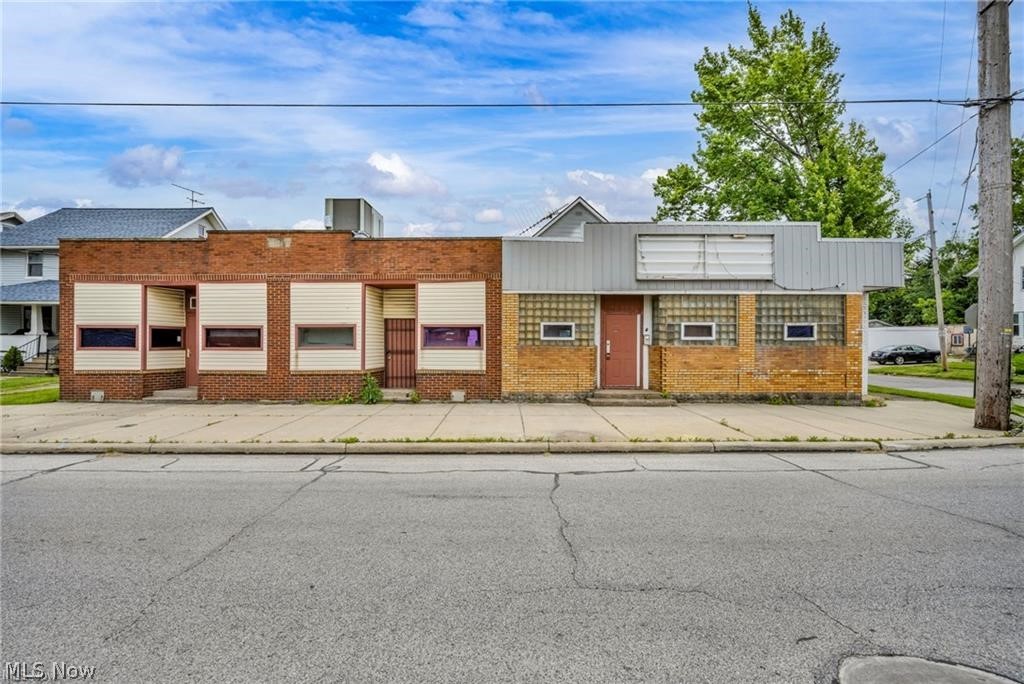 Exceptional Mixed-Use Commercial Opportunity on High-Traffic Corner Lot
Unlock incredible potential with this versatile, fully vacant commercial mixed-use property—formerly a bar and grill—offering outstanding visibility, flexibility, and income possibilities. Situated on a prominent corner lot in an area experiencing active redevelopment, this property is ideal for an owner-occupant, investor, or portfolio expansion.  Inside the property is rough wired, framed and a newer HVAC system.

Commercial Building Features:
• High-traffic location with excellent frontage and visibility
• Former restaurant layout with multiple entrances—perfect for subdividing into separate retail or office units
• Additional rooms ideal for storage, expansion, or reconfiguration
• Full basement with interior access
• Flexible floor plan providing a true blank canvas for your business vision

Residential Home Included:
• Charming attached Cape Cod–style home
• 3 bedrooms, 1.5 baths
• Inviting front porch
• Perfect for an owner-occupant, on-site manager, or additional rental income stream

Additional Property Highlights:
• Large parking lot, partially fenced
• Detached vinyl-sided 3-car garage
• Entire property delivered vacant and ready for immediate occupancy, leasing, or renovation
This is a rare chance to shape a multi-use property in a rapidly improving area. Whether you’re seeking a strategic business location, a value-add investment, or a hybrid live/work setup, this property checks all the boxes.
No liquor license included. Serious, qualified buyers only. No wholesalers.