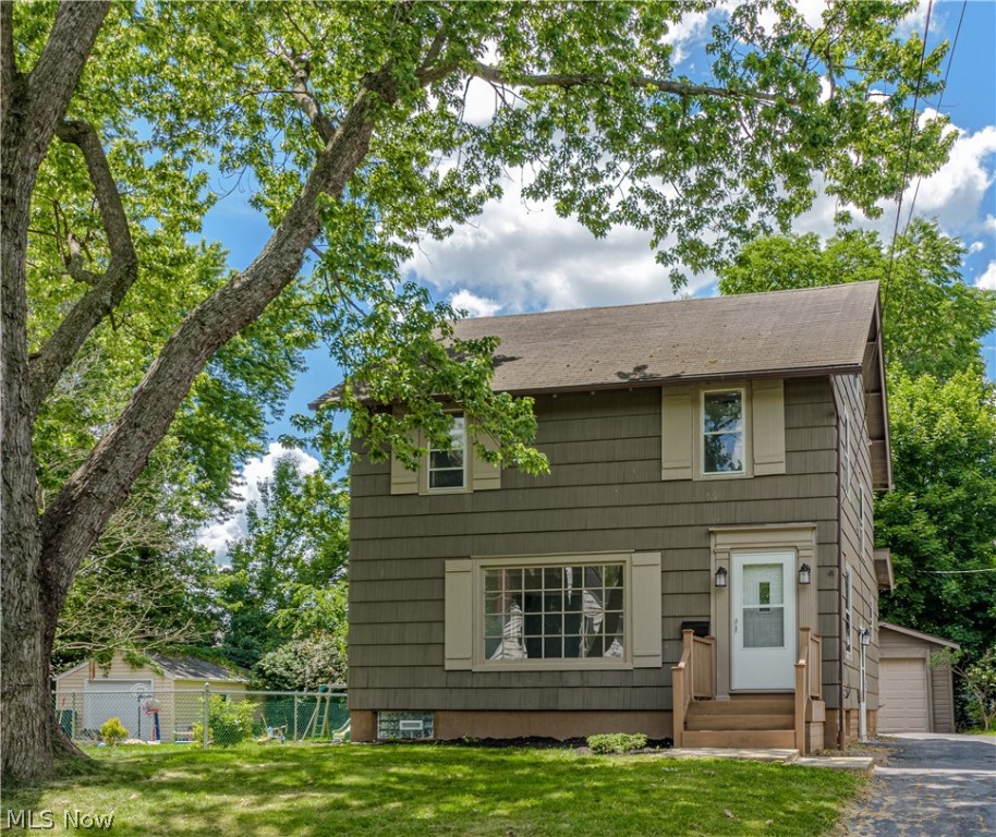Here's a spacious Colonial that has been extensively updated in a desireable  Cuyahoga Falls location just off of Broad Blvd.  Light,bright and open. Freshly  painted throughout with tasteful neutral colors .Step into the large living room filled with natural light from the over sized picture window, decorative fireplace, and new carpet.  Formal dining room with new laminate floor that continues into the cozy family room that has a wood burner for extra warmth in the winter. The kitchen has been gutted and completely updated with new cabinets, counters,attractive back splash, and stainless appliances. Three spacious bedrooms on the second floor plus a nicely finished third floor. Attractive full bath with double sinks and ceramic tile floor. Screen porch overlooks fenced backyard. Electric  updated by Thompson Electric who replaced the electric panel box and the wiring throughout the house.