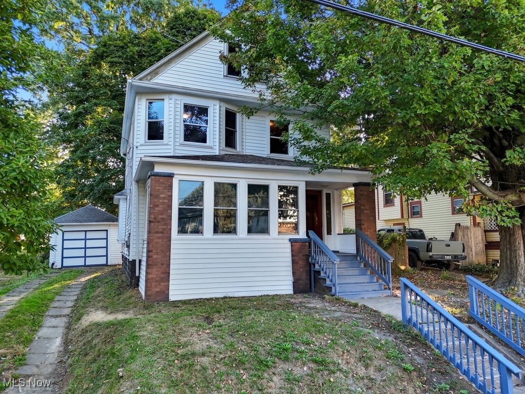 Charming, fully renovated 5-bedroom colonial with 1,809 square feet of improved living space across three levels and a detached garage in Akron. This home offers modern convenience with classic appeal, featuring a brand-new kitchen with abundant cabinet and counter space, and a large, updated full bathroom on the second floor with a new vanity, toilet, surround, and an LED smart anti-fog mirror. All-new flooring throughout and fresh interior paint create a cohesive, move-in ready feel. The first level includes a spacious living room with a sunroom adjacent, a formal dining room, a kitchen designed for entertaining and daily meal prep, and convenient first-floor laundry. The second floor hosts three large bedrooms and the updated oversized bathroom. The full, unfinished basement adds practicality and storage. For peace of mind, the windows are 2 years old. Roof, siding, hot water tank, and electrical panel box are approximately 5 years old. Furnace is approximately 6 years old.