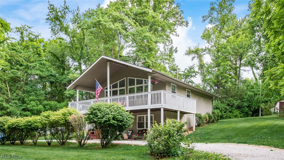 Enjoy breathtaking views of Dillon Lake from this stunning villa-style home, presented in like-new condition. Offering the flexibility of 3 bedrooms, this property is designed for both comfort and entertaining. The impressive great room features soaring cathedral ceilings and a dramatic wall of windows that  showcase panoramic views of the lake and surrounding woodlands, with a  wraparound porch outside for maximum outdoor enjoyment. 

Whether you're looking for a primary residence or the perfect year-round retreat, this home delivers a vacation-like lifestyle every day. Conveniently located just a short drive from Zanesville and Newark, and less than an hour from Columbus, you'll enjoy peaceful lakeside living without sacrificing accessibility.