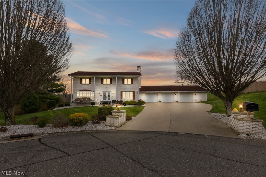 Exquisite all-brick home located in the desirable Country Club community, offering 3,177 sq ft of beautifully updated living space and a 3-car garage. Designed for both comfort and elegance, this home features a stunning chef’s kitchen with quartz countertops, a 10’ x 5’ island, and wood-look ceramic flooring, complete with all appliances.

The spacious owner’s suite offers private access to an upper Trex deck overlooking a resort-style outdoor setting. Enjoy an in-ground heated pool, tranquil pond with waterfall, and expansive patio—perfect for entertaining or unwinding in total privacy.

Main-floor laundry adds convenience, while extensive updates—including kitchen, flooring, gas furnace, water filtration system, pool heater, and more—provide modern peace of mind.

The finished lower level recreation room with bar offers flexible space for entertaining or a potential 5th bedroom with ample storage and walk-in closet.

A rare opportunity to own a private luxury retreat in an exceptional setting.