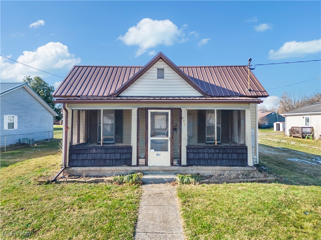 Opportunity awaits with this three-bedroom, one-bath home featuring a closed-in front porch and a newer metal roof. Situated on a very large, flat lot with two outbuildings, offering excellent storage or workspace. Located in the heart of Belpre Ohio and priced to sell.  Ideal for buyers looking to update and add value.  Schedule your showing today and explore the potential this property has to offer.  Opportunities like this don't come often in this price range.