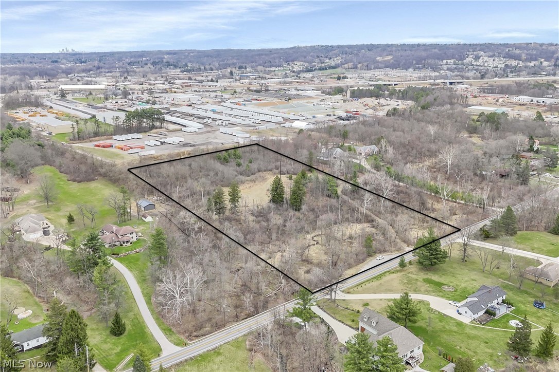 Set on nearly 8 wooded acres in North Royalton, this expansive parcel offers a rare blend of privacy, natural beauty, and everyday convenience. Tucked back from the road and surrounded by mature trees, the property creates a peaceful, secluded setting with the space to design a truly custom home. The visible clearing within the landscape and location of the former home, provides an ideal opportunity for a future homesite, while the surrounding woods offer seclusion and privacy. Nearby established homes add to the appeal, creating a sense of community while still allowing for a private retreat feel. Enjoy the best of both worlds—serene, nature-filled surroundings with quick access to shopping, dining, and major routes. Whether you’re envisioning a luxury estate or a quiet escape, this property offers the space, setting, and potential to bring your vision to life. Bring your own builder and explore the possibilities.