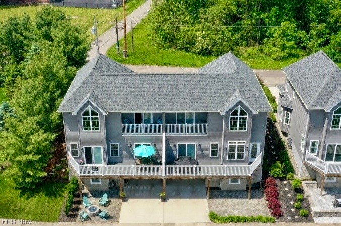 STUNNING LAKE MILTON CONDOMINIUM with your own DOCK!! CUSTOM BUILT and BEAUTIFULLY DECORATED with over 2400 SF OF LIVING SPACE! Featuring TWO STORY LIVING ROOM leading to Composite Deck with great views of lake. The Kitchen & Dining Room were designed for entertaining with CENTER ISLAND, CONCRETE COUNTERS, custom backsplash, pantry and all appliances. The REC ROOM is complete with epoxy flooring, FULL BATHROOM with shower and storage room. You can relax in your own private LOFT with beautiful LAKE VIEW. The Master Bedroom with large WALK IN CLOSET was set up to enjoy the lake view from your COVERED COMPOSITE DECK. The Master Bathroom has double concrete top vanities and CUSTOM CERAMIC TILE SHOWER. The Second Bedroom on main level could be used as a second master bedroom. The Third Bedroom is also on the main level and both have access to the FULL BATHROOM with double concrete top vanities. Additional features include: First Floor Laundry with cabinets & sink, Attached OVERSIZED GARAGE that is 29'x13', Pella Windows & Doors, High Efficiency HVAC system, High Efficiency Hot Water Tank, SOS Security System and Pavers Patio, You will love the WALKING TRAILS and CRAIG BEACH that are close by!! Lake Milton is Ohio’s 72nd State Park. Amphitheater, beach, swimming, fishing, boating, walking and jogging trails plus golf, disc golf, wineries and so much more!!! CALL TODAY for your PRIVATE showing! (Some furnishings will be made available for sale if interested.)