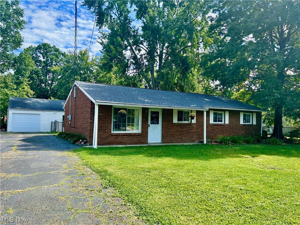 Updated Brick Ranch in Brimfield! Many updates in 2023 including new roof, furnace and AC in May, electric box in September, freshly painted interior and new laminate flooring throughout. Updated kitchen (New sink, countertops, range and microwave) and baths (new vanities, fixtures, lighting, new tub and surround in primary bath). Fenced backyard with concrete patio. 1 car garage with new garage door, extra storage or workshop space. Oversized asphalt driveway with extra vehicle space. One floor living with laundry room (washer dryer). Ready for your finishing touches!