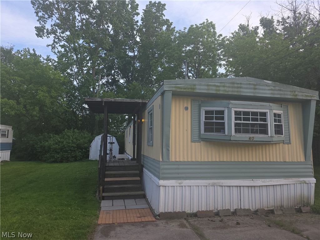 A great opportunity for affordable living in Cuyahoga Falls!  This 2 bedroom 1 bathroom unit in Oak Leaf Mobile Home Park includes gas range, refrigerator, washer & dryer. Bring your decorating ideas and "sweat equity" to make this your home. Needs roof replaced, new carpet and some updates. $410/mo lot rent.