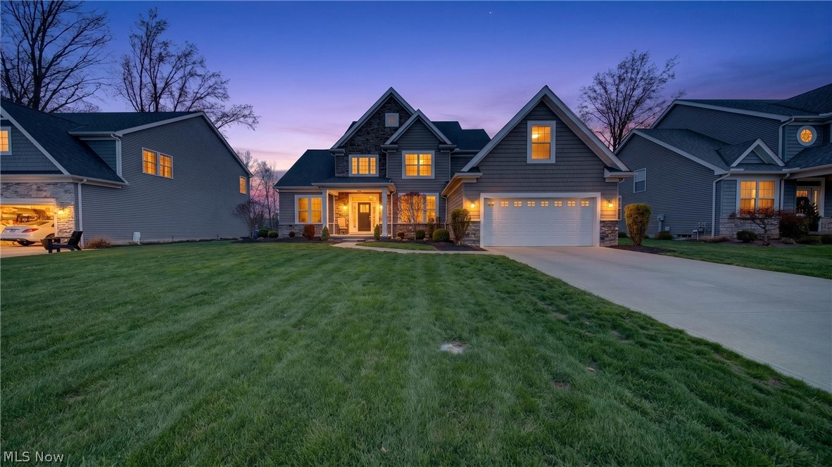 Set on TWO parcels overlooking the 13th hole of Legacy Golf Course with beautiful pond views, this exceptional Avon Lake home offers the perfect blend of luxury, comfort, and lifestyle. The dramatic two-story great room with fireplace is filled with natural light and flows seamlessly into the gourmet white kitchen featuring an oversized island, wine cooler, and abundant space for gathering and entertaining.  The sought-after first-floor owner's suite offers a private retreat with tray ceiling and spa-like bath featuring a walk-in shower. Upstairs, spacious bedrooms provide room for family and guests, while the finished lower level—complete with pool table that stays—creates the perfect space for game nights, movie nights, and entertaining.  Step outside to the stunning paver patio and enjoy breathtaking golf course and pond views, creating a backyard setting that feels like a private resort. Whether enjoying morning coffee, hosting friends, or unwinding at sunset, the outdoor living space is truly special.  Located in the highly desirable Legacy community near Lake Erie, parks, shopping, dining, and top-rated schools. Luxury living, exceptional views, and an unbeatable lifestyle await.