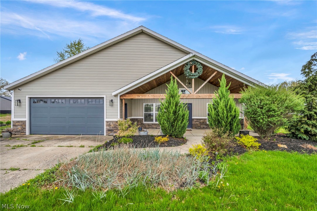 Stunning single family ranch style home in the quiet suburban area of Columbia Station. Minutes from Southpark shopping area. Over two acres of land with a barn. Front porch area with room for sitting welcomes you to come inside to lead you through the inviting hallway to the kitchen area. Kitchen is fully modernized with a rustic modern feel and remodeled with newer Kitchenaid appliances: Fridge, cooktop, oven, microwave, and dishwasher. Solid surface counters with tile backsplash, more than enough cabinet space, barn door style pantry, and three person seating at the kitchen island. Kitchen fills with plenty of natural lighting. Laminate and tile flooring throughout for durability and easy cleaning. Main bedroom on first level with walk in closet. Attached to main bedroom is a glamour bath (duel vanity sinks, large walk in shower with soaking tub, LED mood lighting) creates a calming and relaxing atmosphere. Two larger bedrooms on main floor for guest rooms or office. Two large closets in the main hallway with barn style doors. The very large living/family room with high vaulted ceilings allows for memorable family gatherings or relaxing movie nights. Built in wet bar with fridge for easy access to drinks and snacks. The family room transitions seamlessly outdoors to the covered patio, additional concrete pad for BBQ and a fire pit for storytelling and making smores. Large grass and landscaped lot truly gives you the feeling of open space and suburban vibes. Two car garage provides plenty of storage for two cars and equipment including a couple extra parking spaces to the side of the driveway. This ranch is waiting for you to move right in and enjoy all of its amenities. City water and sewer. Propane heating and fireplace. Whole house was demo'd down to the studs and every inch remodeled in and out. Washer and Dryer included in a separate laundry room on the main floor.