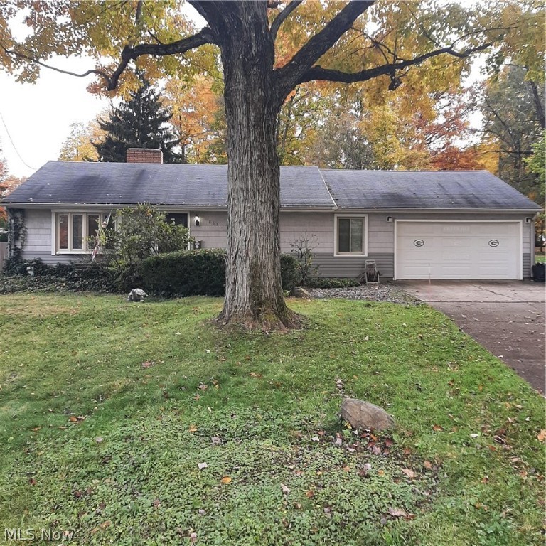 Large, 3 bedroom ranch situated on a nearly half acre lot in walking distance to Mill Creek Park.  Enjoy the convenience of 1,600 square feet of first floor living in this basementless home.  That means no wet, musty basement and a first floor laundry and utility room!  A large family room is open to the kitchen and has two sliding doors; one allows access to a private patio area and the other allows access to a huge, deep back yard.  In the winter, you can warm up by the living room fireplace and enjoy the steady, radiant floor heat.  The bathroom has a handicap accessible bathtub should you have the need.  A skylight adds lots of natural light  The garage is a great place for your hobbies or special projects.  One section is two cars deep leaving lots of work area.  A large floor drain in the front keeps the garage dry and the Naturestone floor makes for a neat appearance and easy cleanup. This home is ready for new owners to provide some TLC and their personal updates and has been p