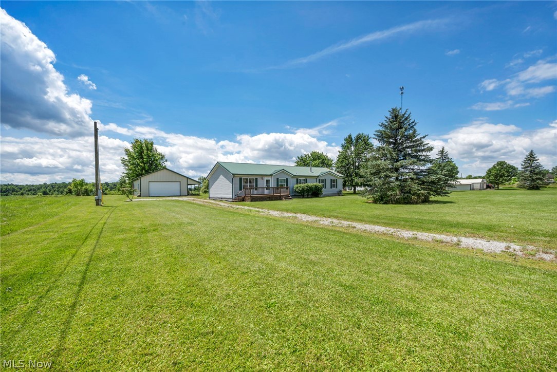 Enjoy the best of small-town living in this well-maintained 3-bedroom, 2-bath home located in the heart of Sullivan, Ohio. Nestled on a manageable lot and surrounded by beautiful countryside, this property offers stunning views of wide-open fields stretching behind the home, creating a peaceful setting you'll love coming home to.

The property features a spacious 24' x 32' pole barn complete with a covered porch area, providing ample space for storage, hobbies, vehicles, or outdoor entertaining. Whether you're enjoying your morning coffee or relaxing after a long day, the scenic country views are sure to impress, and you can enjoy them from your sunroom off the back of the home or your front porch. 

Sullivan offers the charm of a close-knit community with a hometown feel, including a local market and the quiet pace of country living. Conveniently located in the Black River Local School District, this home combines rural beauty with everyday convenience.

If you've been searching for a property with country views, low maintenance living, and the warmth of small-town Ohio living, this is one you won't want to miss.