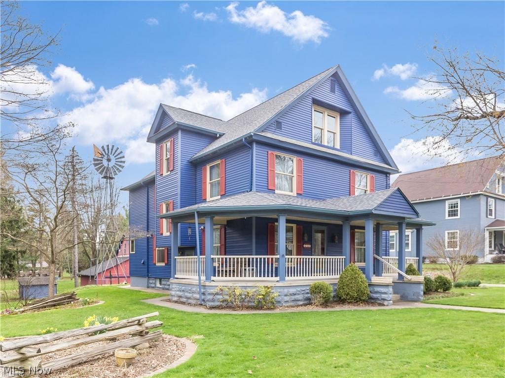 Meticulously maintained 3 bedroom, 2.1 bath Century home. Lots of curb appeal and charm with the large wrap around porch and plenty of beautiful original woodwork throughout the home. Spacious and open kitchen with a center island and dinette plus built-in desk area. You will also enjoy the wood plank ceiling, custom Oak flooring, granite countertops, circular island that includes most appliances and a 1st floor laundry. Parlor has a gorgeous staircase and formal dining room with window seat. 2nd floor has 9' ceilings. Master bedroom has an attached solarium w/cedar walls & ceiling, slate floor & dry sink. The private bath features redwood accents and a bathtub. There are 2 more spacious bedrooms w/adjoining closets plus an office or sitting room. Added bonus is a walk-up attic that provides additional storage space. There are several outbuildings including a smokehouse, 4 car garage/barn with loft, and shed. Updates include: furnaces 2001, hot water tank 2012, refrigerator and water s