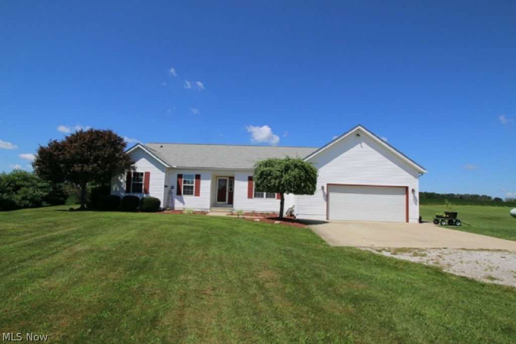 This is a nice custom built hillside ranch that has a rear view over farm fields to a woods, beautiful sunsets...this home features a very open floor plan, four bedrooms up, den/office, and a 1st floor utility.  Downstairs there is a huge walkout basement with an additional bedroom that is not included in the sq. ft.  Outside there is a nice large deck, lots of concrete, and an additional 38' X 52' outbuilding complete with a concrete floor for all of the hobbies.  Good location for an easy commute.  The owners are downsizing but have really enjoyed all this space.