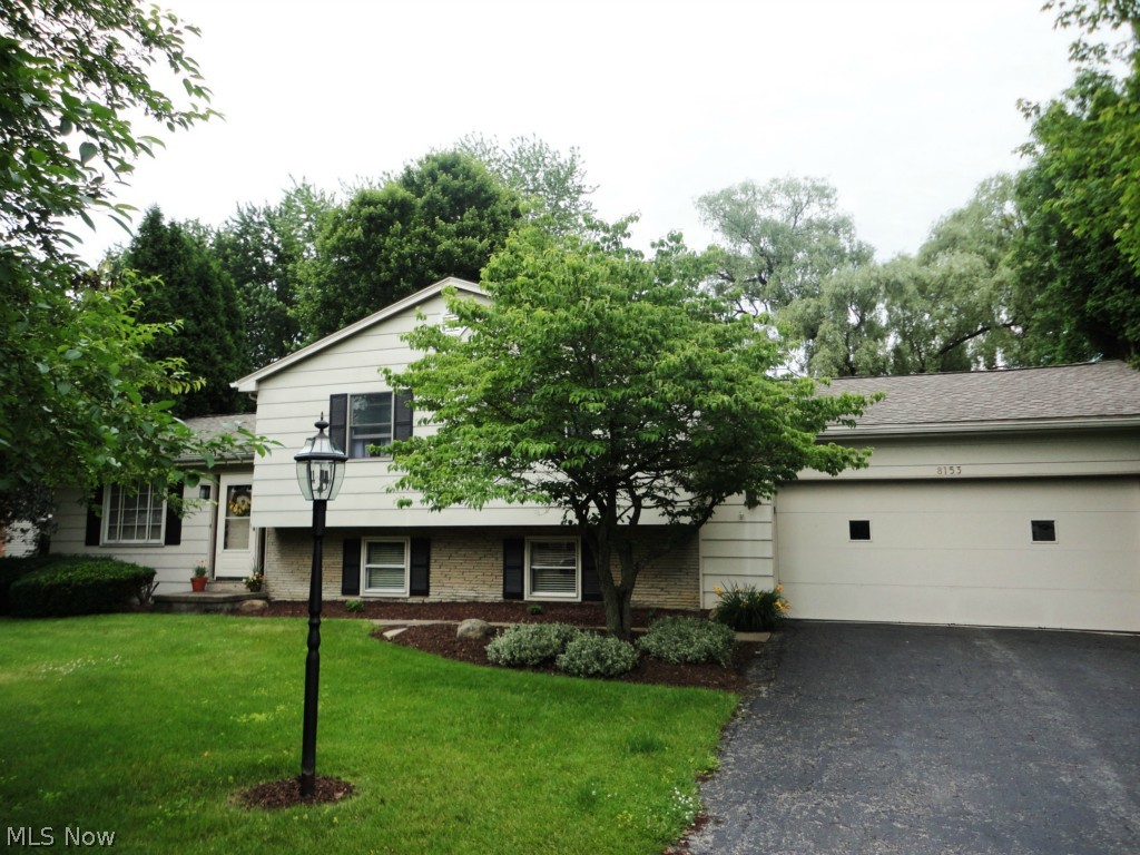 Great Poland location in a quiet neighborhood with no thru traffic!  Spacious 4-level split is built for comfort and entertaining with its large eat-in kitchen leading to the welcoming 3-seasons room and huge 30 X 20 deck.  A few steps down from the main level is the family room with gas fireplace, a full bath, and large laundry/mud room.  A few more steps takes you to the finished basement with a built-in bar.  All 3 bedrooms and another full bath are on the upper level.  Well built with plaster walls and extra insulation in the ceilings and walls which keeps the energy costs down; gas budget is $90/month and electric $60-90/month.  The 2-car garage has an extra 24 X 16 workshop with extra insulation in the walls, lots of workbench space, storage and cabinetry.  A new roof was installed last year.