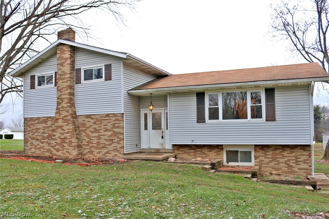 Country property on 2.6 acres.  Large split level home with 3 bedrooms and 2.5 baths.  Large outbuilding with 2 stalls and plenty of room for storage.  Additional building was previously used as a chicken coop.  Wonderful property.