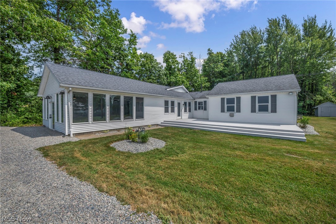 Experience the best of Ohio’s North Coast with this completely remodeled ranch situated on 2.46 scenic acres in Ashtabula, offering breathtaking, unobstructed views of Lake Erie! While this is not a lakefront property, it sits directly across the street from the lake, allowing you to enjoy spectacular panoramic water views without the lakefront price tag.

Boasting over 2,000 square feet of beautifully updated living space, this 3-bedroom, 2-bath home has been renovated from top to bottom. The stunning new kitchen showcases brand-new cabinetry, gorgeous quartz countertops, and a designer tile backsplash, creating the perfect space for cooking and entertaining. Both bathrooms have been completely remodeled, the entire interior has been freshly painted, and luxury vinyl plank flooring flows throughout the home, making it truly move-in ready.

Outside, the possibilities are endless! A massive pole barn with electric is located at the rear of the property and offers incredible flexibility. Finish it into additional living quarters, a guest suite, workshop, event venue, party barn, or the ultimate entertainment space—the possibilities are limited only by your imagination.

Located just minutes from Geneva-on-the-Lake, the Grand River Valley Wine Country, marinas, beaches, Geneva State Park, and SPIRE Institute, this property is ideally positioned in one of Northeast Ohio’s premier vacation destinations. Whether you’re searching for a year-round residence, weekend getaway, or a lucrative Airbnb/short-term rental opportunity, this one-of-a-kind property offers exceptional versatility, unforgettable Lake Erie views, and endless potential.