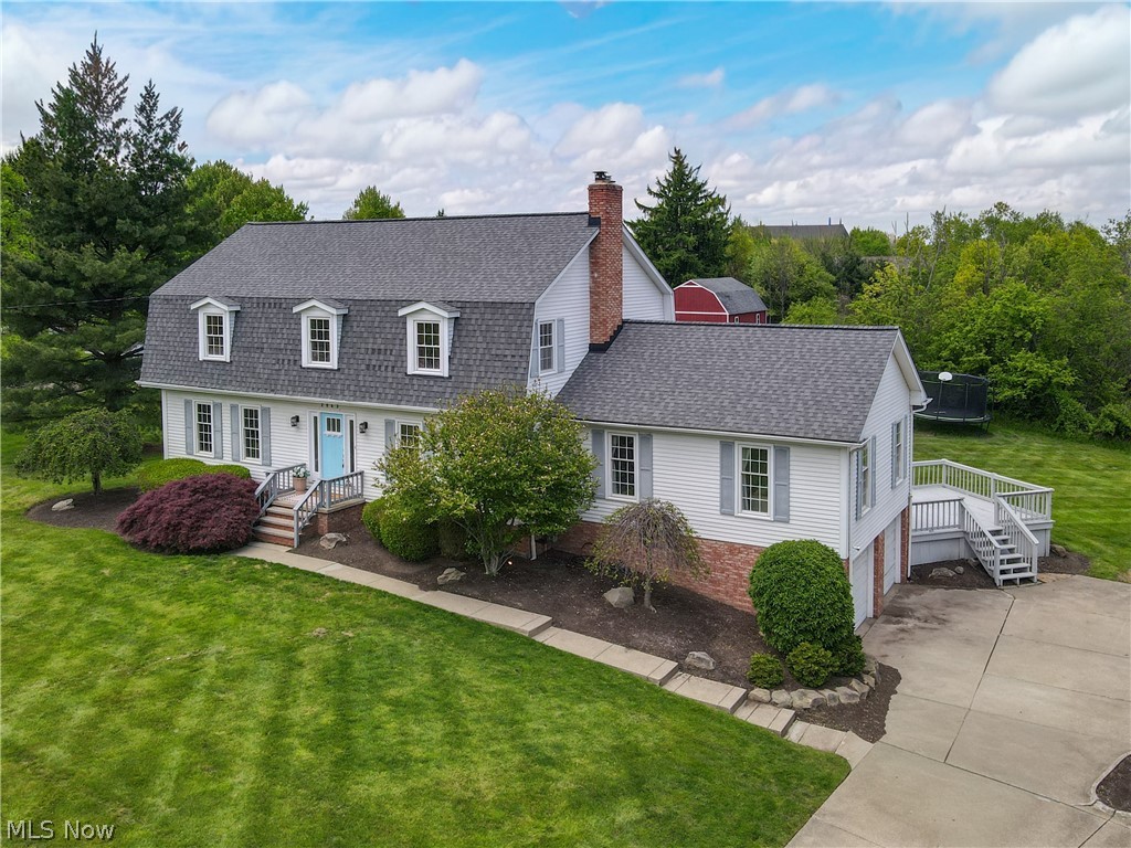 Welcome to this stunning colonial situated on nearly 1 acre, offering the perfect blend of timeless charm and tasteful modern updates. From the moment you step inside, you’ll appreciate the thoughtful design and inviting spaces throughout. The main floor features a formal living room with an eye-catching accent wall and newer flooring that continues into the dining room, creating a warm and cohesive feel. The updated kitchen serves as the heart of the home with gorgeous hardwood floors, stainless steel appliances, abundant cabinetry, and access to the back deck—perfect for everyday living and entertaining alike. The true showstopper is the oversized family room, designed for gatherings both large and small. Featuring a cozy wood-burning fireplace, custom built-in cabinetry that creates a beautiful backdrop to the wet bar, and additional space for a dining table or secondary seating area, this room is ready to host every occasion. A private office, half bath, and convenient laundry room complete the main level. Upstairs, the spacious primary suite is filled with natural light and offers a large walk-in closet along with a beautifully updated en-suite bathroom featuring a soaking tub, oversized tiled shower, and double vanity. Three additional generously sized bedrooms offer hardwood floors, ample closet space, and share the hall bath. The finished basement provides incredible flexibility with a large recreation area and two separate rooms ideal for guest suites, offices, workout rooms, or hobby spaces. A storage closet already plumbed for a full bathroom offers even more future potential. Outside, enjoy the expansive backyard, multiple deck seating areas, and a recently added fire pit space—perfect for relaxing evenings and entertaining outdoors. This beautifully updated home offers space, style, and comfort both inside and out. Furnace-2023, Water Tank-2022, Roof-2016.