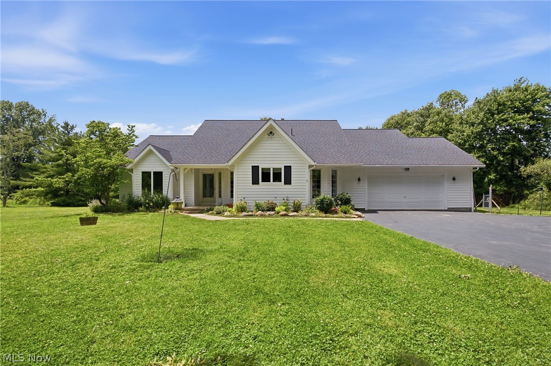 Tucked away from the road, this beautifully maintained sprawling ranch home sits on 5.76 ACs, offering the perfect blend of comfort, nature, & endless possibilities. Perfect setting for horses, livestock, gardening, orchards, recreation, or simply enjoying wide-open space & privacy. From the front porch, step inside to discover a spacious floor plan featuring 3 BRs, 2.5 BAs, & a stunning great rm w/built-in bookshelves, vaulted ceilings, skylights, & a wall of windows overlooking the picturesque backyard. The large 3-season sunroom extends your living space & provides the perfect spot to relax while enjoying peaceful views & abundant wildlife. The eat-in kitchen features an island, updated butcherblock countertops, & flooring, while the formal dining rm is ideal for family gatherings & special occasions. Designed w/privacy in mind, the owner's suite occupies its own wing of the home & offers direct access to a private deck, walk-in closet, & en-suite bath complete w/a soaking tub, separate shower, vaulted ceiling, & skylight. Two additional spacious BRs & a full bath are located on the opposite side of the home. A 1st flr laundry, half bath, & attached 2-car garage. The expansive 29x38 BSMT, plus 2 Lg. Crawl space provides excellent storage & future finishing potential. Outside, 2 storage sheds. Adding even more value, the property includes mineral royalties & free gas. Major updates include flooring, butcher block countertops(2024-25), refrig(2023), dishwasher, carpet & Gutter Guards(2024), gas furn(2023), HWT & water softener (2025), asphalt driveway( approx. 2000), & roof(2019). Nature lovers will appreciate the location backing to protected Akron Watershed land surrounding LaDue Reservoir. Enjoy nearby fishing, kayaking, & paddleboarding. Conveniently located near ST RT 422 for easy access to shopping, dining, & commuting routes while enjoying the tranquility of country living. Located in the highly sought-after Kenston School District. Begin your story here!