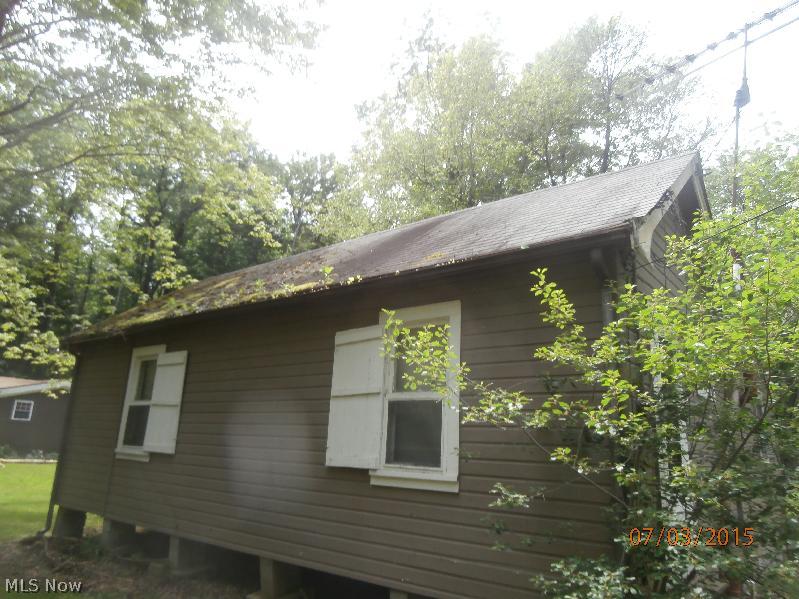 Potential, potential, potential!!! Unique cabin situated on 6 parcels including 280415000, 280413015200, 280413018100, 280413018200 and 280413018300. Structure has Foundation issues and needs a new roof. Composting toilet and laundry off bedroom area.  Large Eat n Kitchen/Family Rm area. 3lots are on Kenmore Ave, which has not been finished yet, so lots of potential there.  How can you lose at this price.