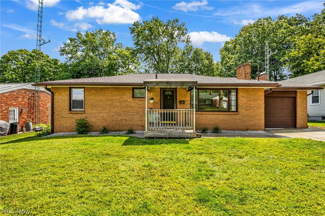 Charming All-Brick Ranch with Modern Updates! This well-maintained 3-bedroom, 1-bath home offers comfort, character, and move-in-ready appeal. The spacious living room features a cozy wood-burning fireplace, while the kitchen includes stainless steel appliances, a built-in oven, and newer luxury vinyl flooring that extends into the updated bath. Hardwood floors add timeless charm throughout much of the home. The fully renovated bathroom features a stylish walk-in shower. The finished lower level boasts a 34' x 12' recreation/bonus room with a wet bar-perfect for entertaining, a home office, fitness area, or additional living space. Additional updates include an EverDry waterproofing system, newer concrete driveway, and sidewalk. Situated on a quiet residential street, yet conveniently close to shopping, dining, schools, and other amenities. More photos coming soon!
