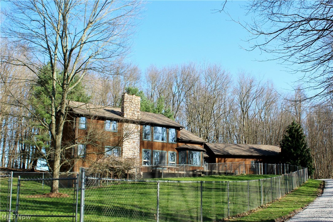 SECLUDED PRIVATE RETREAT at THE RETREAT Development!!! You will enjoy the OVER 16 ACRES of WOODED Property and GORGEOUS LAKE!! This CUSTOM BUILT HOME has an AMAZING OPEN FLOOR PLAN and approximately 3100 SF!! Featuring TWO STORY GREAT ROOM with STONE CORNER FIREPLACE, sliding doors leading to MULTI LEVEL COMPOSITE DECKS & lake view, CHEF STYLE KITCHEN with commercial grade appliances & Corian counters; Dining Area with bay window overlooking woods & lake; FIRST FLOOR PRIMARY BEDROOM with tray ceiling, sliding doors to deck & walk in closet; Primary Bathroom with Jacuzzi whirlpool bathtub, double vanities & corner seated shower; Office with custom built in shelves & cabinetry; Loft overlooking Great Room; Two Additional Bedrooms with large closets; Second Full Bathroom with double vanities; Half Bathroom; First Floor Laundry/Mud Room with bonus closets, Full 12 Course Basement with wood burner, WALK OUT feature & rough in plumbing for additional bathroom; Attached THREE CAR GARAGE (28'x40') with DOG KENNELS and Chain Link Fenced yard. Additional items include: Geothermal heating & cooling, tongue & groove ceilings, central vacuum system and Kinetico water softening system with reverse osmosis. CALL TODAY to schedule your PRIVATE SHOWING of this FANTASTIC HOME!!!