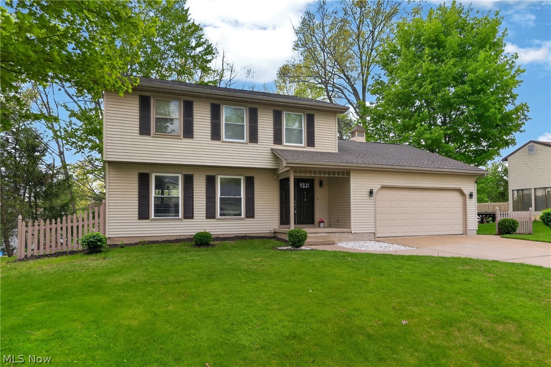 Imagine stepping home to this beautifully updated and meticulously maintained Canfield colonial. The welcoming foyer opens to a bright, spacious living room that flows into the formal dining room, ideal for daily living and entertaining. The updated kitchen features a new island, cabinets, countertops, stove, microwave, hood, and ceramic tile flooring. A refreshed first-floor powder room includes a new vanity, light-up mirror, toilet, sprayer, and new doors across the main level, with new flooring enhancing its move-in-ready feel. The oversized family room offers a cozy space with a wood-burning fireplace and sliding doors to the back deck, overlooking a peaceful, park-like backyard. The finished basement adds significant living space with new drywall, flooring, a full bathroom with a shower, bar, gym, kids’ room, workshop, and laundry room. The attached two-car garage provides attic storage and easy kitchen access. Upstairs, three spacious bedrooms with ample closets feature updated full bathrooms with standing showers, new tiles, vanities, mirrors, toilets, sprayers, and new windows. The recent upgrades including a new roof (2015), vinyl siding (2015), furnace (2019), central air (2020), electrical panel (2022), new 7 windows in (2024), water tank (2011), and interior updates like new flooring, fixtures, and porch columns. Fully updated throughout, it offers comfort and modern convenience, ready to move in. Located just 3 minutes from CH Campbell, 8 minutes from Canfield Middle School, and near the Mill Creek bike path, in a desirable neighborhood, this home checks all the boxes.