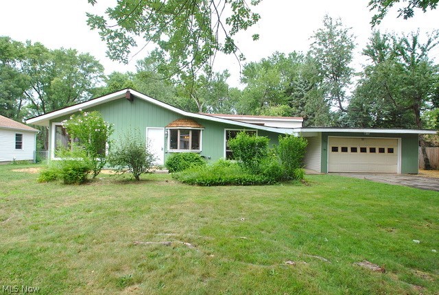 Your appreciation will start as soon as you open the front door to this air conditioner, mentor ranch with its open look, hardwood floors, beams, vaulted ceiling, and wood burning fireplace with windows all around. This home has hardwood floors throughout. Full baths. 3  bedrooms, with possibly a fourth with your imagination, and all the extra square footage that's available. The Kitchen attached to the great room has a wide open look, beautiful granite counters, with a snack bar seating. All appliances, stay. The sunroom has hardwood floors, windows all around, overlooking the yard vaulted ceiling with a skylight that opens, and a gas fireplace to enjoy the warmth and winter snowfalls. The sunroom also has a separate entrance and access to the attach 2 car garage with opener. The home is close to shopping, schools, and community centers. The yard features additional parking if needed for campers or boats, and plenty of room for children to play.