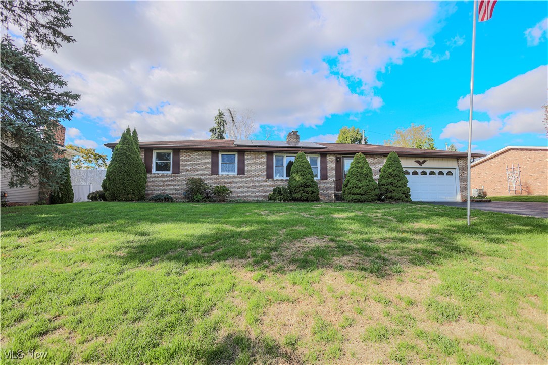 Welcome Home! Nestled in the desirable Louisville / St. Thomas Aquinas area, this charming ranch offers comfort, convenience, and a wonderful sense of community. Situated on a nice-sized lot in a highly regarded school district, this home combines small-town warmth with easy access to main routes, shopping, and local amenities.  Step inside to a bright and cheerful living room filled with natural light, leading to a spacious eat-in kitchen with plenty of cabinet space—perfect for family meals or entertaining friends. The main level features three nicely sized bedrooms, each with generous closets, and a full bath.  The lower level offers even more living space with a cozy recreation room and fireplace, a large storage area, and a laundry room with additional storage options.  Outside, enjoy the fenced-in yard, cute patio, and oversized two-car garage with Nature Stone flooring—ideal for gatherings, hobbies, or extra space. The paved driveway and well-kept landscaping add to the curb appeal.  A wonderful place to call home—where comfort meets convenience in one of the area’s most sought-after neighborhoods!