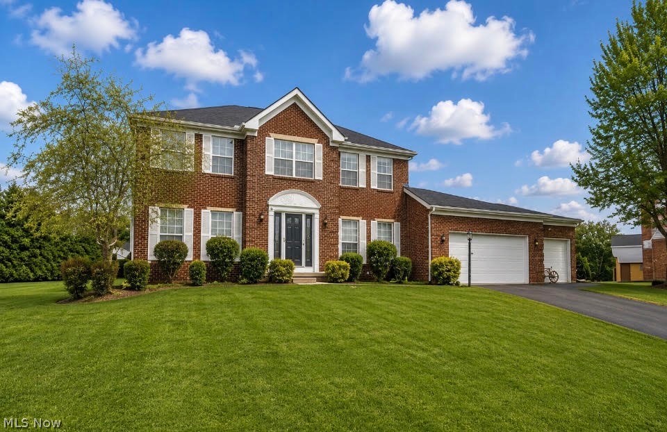 Welcome to this stunning four-bedroom, 2.5-bath luxury home designed for both comfort and style. The spacious first floor features a convenient laundry room, private home office, and an inviting layout perfect for everyday living and entertaining. The heart of the home is the beautifully appointed kitchen with granite countertops, a large center island, and ceramic tile flooring, opening to a generous family room highlighted by a cozy gas fireplace with elegant ceramic tile surround. Just off the kitchen, the dining room provides the perfect setting for gatherings and special occasions. Upstairs, retreat to the expansive primary suite featuring vaulted ceilings and a luxurious private bath, creating a true owner's sanctuary. Three additional bedrooms offer brand-new carpet and stylish LVT flooring, along with a fully updated second-floor bath featuring new tile. The home also includes an oversized three-car garage providing ample space for vehicles, storage, or hobbies. A full unfinished basement offers endless possibilities ready for you to design the perfect recreation area, gym, or additional living space. This exceptional home blends modern updates, generous living spaces, and timeless design, making it the perfect place to call home. Hyde Park Dev in Green Local Schools. Roof 2023, HVAC 2021, HWT 2019