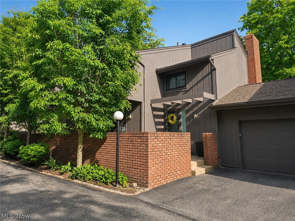 Welcome to your dream townhouse perched right on the rim of Cuyahoga Valley National Park!This exceptional 2-bedroom, 2.5-bathroom home offers breathtaking, park-like views and unmatched access to endless hiking and biking trails just steps from your door. Enjoy peaceful mornings on your private front courtyard patio, or unwind on the back deck while taking in the serene, wooded backyard. Inside, the beautifully updated kitchen (2016) features classic oak cabinets, granite countertops, and a full suite of included appliances and step outside to the courtyard patio. The formal dining room flows effortlessly into a spacious living room centered around a cozy wood-burning fireplace. A convenient updated guest bath completes the main floor. Upstairs, the second level hosts two expansive bedrooms. The large primary suite boasts a dual closets, while the second bedroom features ia private balcony and walk-in closet with pull-down attic access for extra storage .The fully finished basement adds massive value, offering a generous recreation room that easily doubles as an optional 3rd bedroom, complete with a full bathroom and a large laundry/utility room. Key Updates & Highlights:New windows installed in 2020,Concrete patio and steps completed in 2019,Kitchen and bathrooms updated in 2016,Attached 2-car garage,1-Year Home Warranty included!Living in the Greenwood community grants you access to premium recreation amenities, including indoor and outdoor swimming pools, a fitness center, a sauna, tennis and pickleball courts, a fishing pond, a community garden, and party rooms. Conveniently located near I-271 and I-77, you are just a short drive from downtown Cleveland, Akron, major airports, and local suburbs.