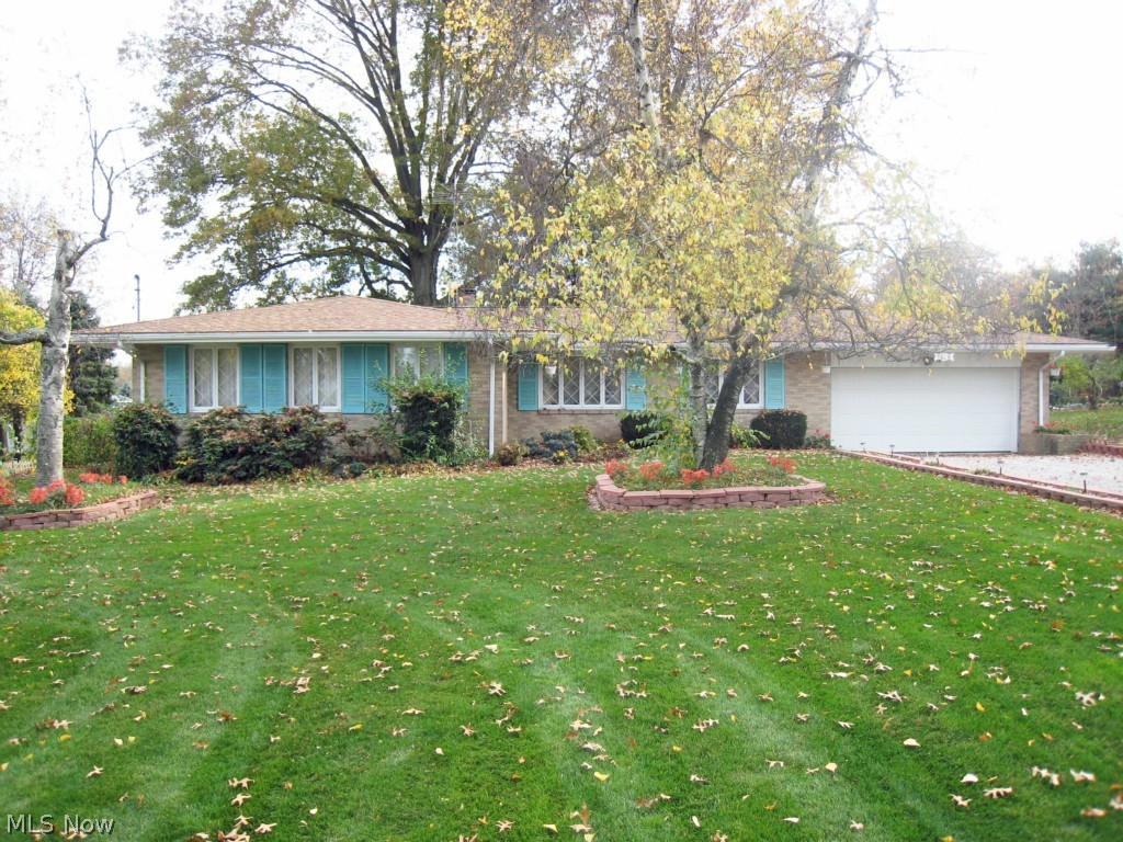 If you're looking for a spacious brick ranch on a great lot, consider your search over! This 3 bedroom, 2.5 bathroom home sits on a 105'x200' corner lot.  Hardwood floors throughout. Open the front door and step into the large living room which is open to the dining room. Kitchen has a breakfast bar and is open to the family room.  Family room features a wood burning fireplace and a sliding glass door to the patio. Backyard is large and has a private park-like feel.  Master bedroom includes full master bath. Basement is large, open and ready to be finished. Recent updates include new high-efficient furnace(2008), new roof(2009),new well pressure tank(2005), and newer water heater. Ranch homes are in high demand so schedule your showing before it's sold!