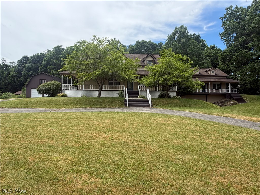 Welcome to this impressive custom home situated on approximately 4 beautiful acres in the highly desirable South Range School District, offering space, privacy, and versatility for modern living. Featuring just under 4,000 square feet of living space, this property includes 4 bedrooms, a first-floor master suite, an in-law suite, 4.5 bathrooms, and a finished basement, making it ideal for multi-generational living, entertaining, or those simply seeking room to spread out.

The spacious kitchen is designed to impress with new appliances, granite countertops, ample cabinetry, and generous workspace for cooking and gathering. The home's thoughtfully designed layout provides comfortable living areas, large bedrooms, and abundant natural light throughout. The first-floor master suite offers convenience and privacy, creating a relaxing retreat complete with a spacious layout and well-appointed bath.

The finished basement adds valuable living space and can serve as a recreation room, home theater, fitness area, or additional entertaining space.

Recent upgrades include new carpeting, upgraded HVAC, water softener equipment, and a new heat pump.

A standout feature of this property is the incredible 40' x 60' two-story detached garage/shop, built with 8-inch concrete flooring and equipped with three overhead doors. Whether you're a car enthusiast, contractor, hobbyist, or need extensive storage space, this building offers endless possibilities.

This exceptional property combines the comfort of a spacious home with the functionality of an extraordinary outbuilding, all within the highly regarded South Range School District. With extensive living space, a first-floor master suite, private in-law accommodations, and significant recent upgrades, this one-of-a-kind estate offers the perfect blend of luxury, practicality, and country living. Schedule your private showing today!