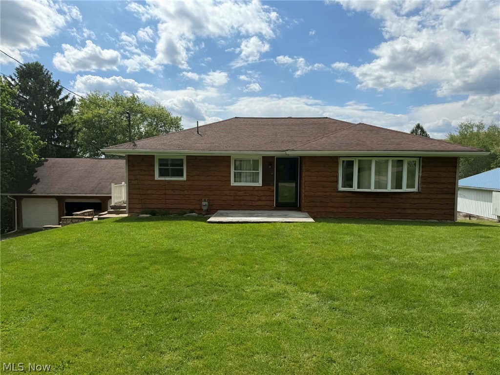 This well-maintained ranch home situated on approximately 1 acre offers spacious living inside and out with a finished basement, attached lower-level garage, and a large detached 3-car garage perfect for extra vehicles, storage, or workshop space. The home features updated flooring, an updated kitchen with island seating, spacious living areas, and a nicely finished lower level for additional living or recreational space. Outside, enjoy the extensive stonework, large covered patio ideal for entertaining, and a private backyard setting with plenty of room to relax. Conveniently located in Wellsville, this property combines comfort, functionality, and excellent outdoor amenities all in one package.