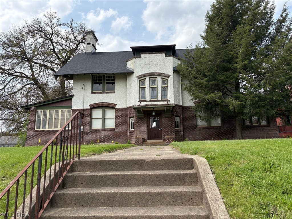 Now is your chance to live in a beautiful Canton Tudor home offering the perfect blend of historic charm and modern amenities. Featuring stunning craftsmanship from the 1900s, this versatile property is ideal for professional offices or residential use, making it a unique opportunity for those seeking a home business setup. This property boasts hardwood and slate flooring, and a fenced yard with a 4-car garage.  Stained glass window featured above the staircase to the 2nd floor. The 1st floor has a full kitchen with dining nook, living and dining rooms, den/office, family room, 1 full bath and 1 1/2 bath. The second floor offers three bedrooms with two baths, while the third-floor features two additional bedrooms and a bath. Updates include a new roof, furnaces, and central air ensuring comfort and functionality. Conveniently located near Downtown Canton, Historic Ridgewood, and Malone College, this property provides quick highway access and ample parking.? Don't miss your chance to own or lease this distinctive Canton Tudor gem!