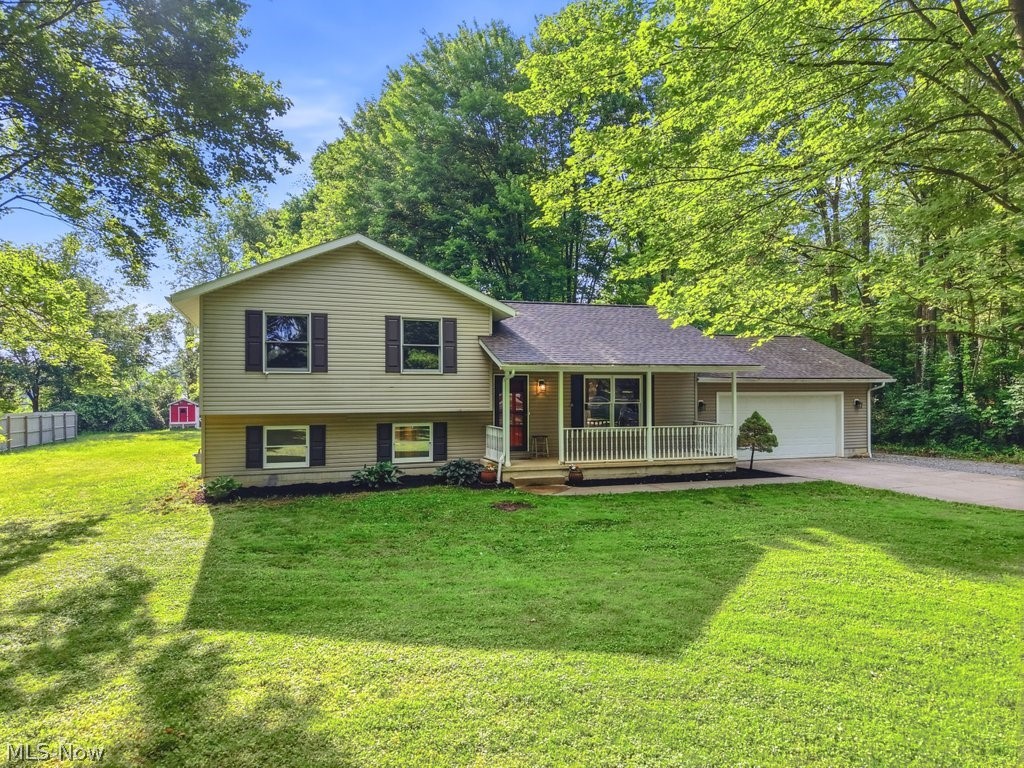 Welcome home to this beautifully updated 3-bedroom, 1.5-bath property offering over 1,600 square feet of finished living space on a scenic, wooded 1+ acre parcel in the Highland School District. The spacious eat-in kitchen features warm wood cabinetry, stainless steel appliances, and abundant storage, while the expansive dining area provides the perfect setting for entertaining, and includes sliding doors that open to the peaceful backyard. Recent updates throughout the home include beautifully renovated full and half baths, fresh interior paint, updated interior doors and trim, newer carpeting in the bedrooms, and luxury vinyl plank flooring in the family room. Additional mechanical improvements include: newer roof and gutters 2021, a hot water tank installed in 2022 and a newer HVAC 2018.

A standout feature of this property is the impressive 24’ x 32’ pole barn built in 2024, accessed by an extended gravel drive (additional 3 car garage). Designed with versatility in mind, the building offers 12-foot ceilings, a garage door opener, all-new electrical service with a dedicated 100-amp panel, gas service, insulated 6-inch walls, and wiring ready for EV charging. The home itself is serviced by a 200-amp electrical panel.

Enjoy the privacy and tranquility of the expansive wooded setting while benefiting from modern updates and exceptional outbuilding space—perfect for hobbyists, car enthusiasts, contractors, landscapers or anyone seeking additional storage and workspace. This move-in ready property offers the perfect blend of comfort, functionality, and charm.