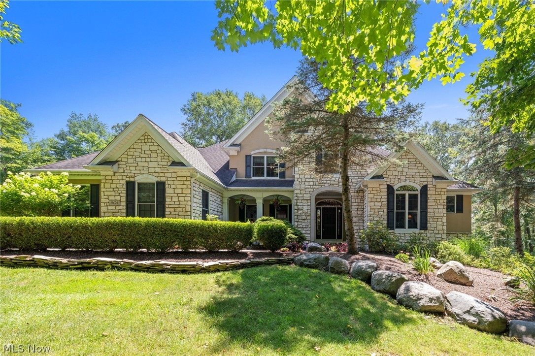 Beautiful Custom Built Home by Payne & Payne nestled on 3.5+Private Wooded Acres! This Spacious home boasts over 5000 finished sqft with 4 Bedrooms, 4.5 Baths & open concept living. Inviting Foyer welcomes you into the Dining Room with butlers pantry & vaulted Home Office with transom french doors. Sun-filled 2-story Great Room with wall of windows & stone fireplace. Gourmet Kitchen with maple cabinetry, granite counters, center island breakfast bar, travertine tile backsplash, double oven, gas cooktop & ceramic flooring through to Dining area with access to the screened-in cedar tongue & groove sun porch & Trex deck. Retreat to the 1st floor vaulted Primary Suite with hardwood floors, large walk-in closet & Glamour Bath with separate vanities & soaking tub. Second floor includes 2nd Master Bedroom with private bath & walk-in closet plus 2 additional bedrooms & full bath. 1st floor Laundry Room & half bath. Full finished lower level includes Family/Media Room with new carpeting, stone fireplace, Full Bath with steam shower & 6-person sauna and walk-out to brick paver patio with waterfall & pond. Relax and entertain in the expansive outdoor living space complete with heated 35 ft in-ground pool installed in 2022 with concrete decking, surrounded by wrought iron fence and complete with covered outdoor kitchen & bar, built-in firepit. Situated on quiet cul-de-sac street in prestigious Walden Oaks community, this home is surrounded by mature trees with professionally landscaped yard and manicured beds full of lush plantings. Paved drive with turn-around, 3+car attached garage plus storage shed. Ideal home for the growing family or multi-generational living. Thoughtfully designed and cared for with many upgrades throughout....must see to appreciate all this home has to offer! Immediate occupancy. Close to schools, Geauga Parks & hospital, YMCA and just minutes to freeways and all amenities!