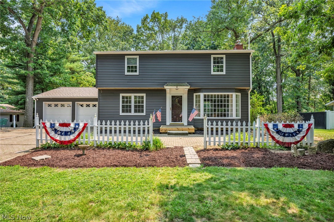 Beautiful, move-in ready, and waiting for you to make your own! This three bedroom, one and a half bath Colonial-style home has stunning character and craftsmanship that is hard to replicate. Solid hardwood floors, built in cabinets, double ovens, and a fireplace perfect for gathering near in the winter months. The main floor features a cozy living room, a dedicated dining area, as well as an additional living space adjacent to the kitchen and large rear patio. Upstairs, three well-proportioned bedrooms complete with hardwood oak floors provide plenty of room to spread out. The full bath offers dual sinks with tile finishes for extra appeal and longevity. The finished living space in the basement is perfect for a hobby room, home office, or can be converted into additional entertainment space. Natural gas forced air, hot water heater, and dryer. It is also complete with central air, and a private septic with an aeration system. 

The picturesque paver driveway leads to a large attached 2-car garage. The adjoining greenhouse is a standout feature—perfect for plant lovers or anyone seeking a serene backyard retreat. Mature trees frame the property, and the wooded backdrop offers privacy and fantastic shade on these warm summer evenings. The Sellers have just had the exterior freshly sided with landscaping updates under way! Enjoy peaceful, park-like living in a freshly updated home just moments from Cambridge and New Concord. Located in East Muskingum Schools! Call today to make this one THE one!
