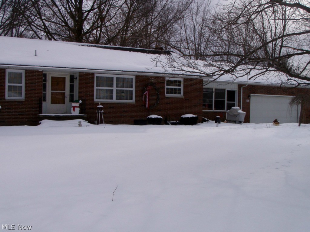 Located on dead-end street. Sprawling brick ranch features hard wood floors, wood burning fireplace, sunroom and 2-car attached garage.