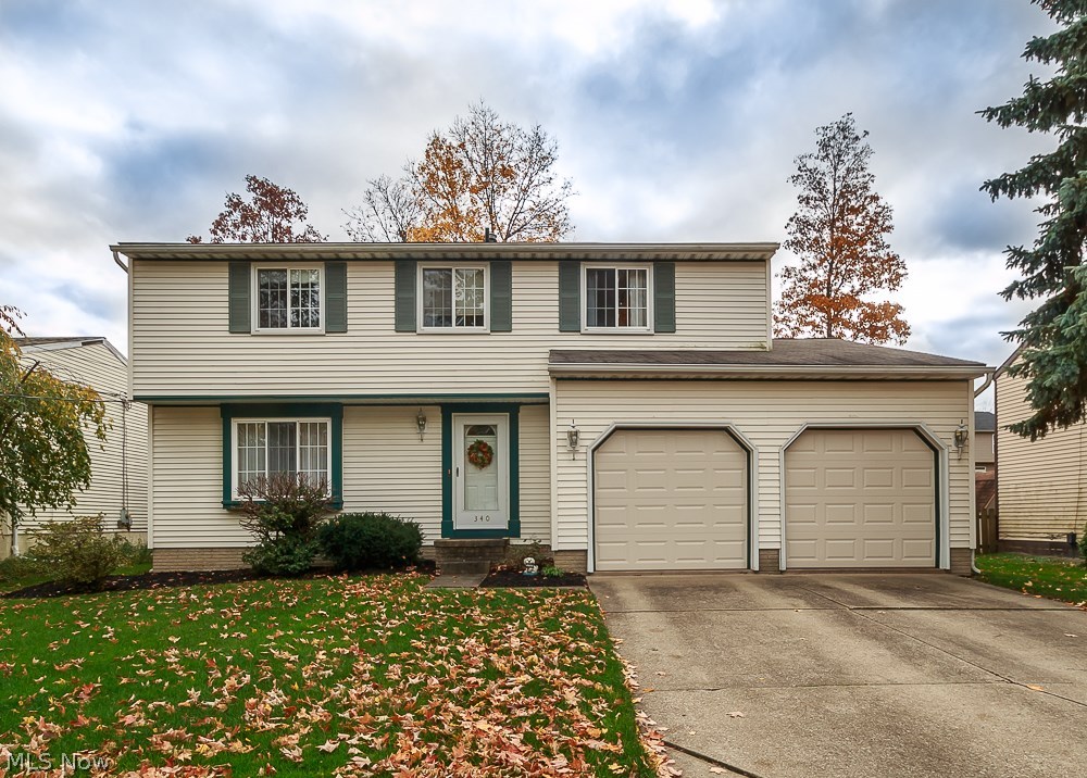 Lovely colonial, beautiful sun porch, 20x13 deck and fenced in backyard.  Quiet cul-de-sac street. Walking distance to school. This home features many newer updates including new garage doors, hot water tank, appliances and more.