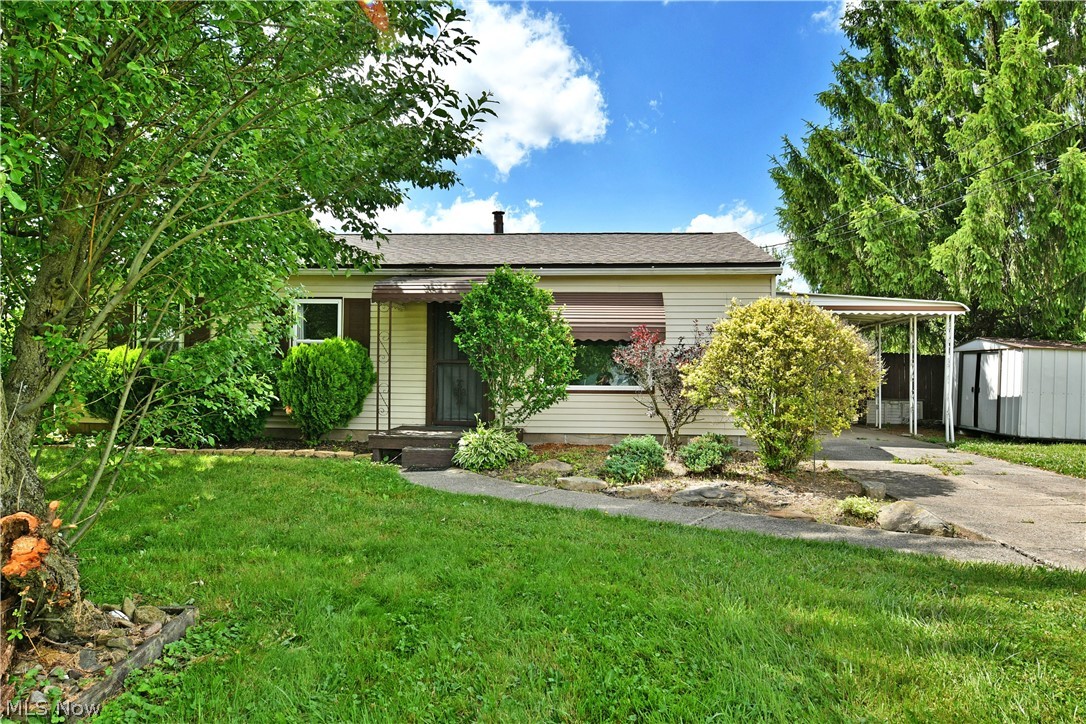 Welcome home to easy one-floor living in this well-maintained ranch offering comfort, convenience, and numerous updates throughout! The spacious living room features newer carpeting and a large new picture window that fills the home with natural light. The adjoining eat-in kitchen offers white cabinetry, neutral counter tops, vinyl flooring, and all kitchen appliances will remain.

This home features three nicely sized bedrooms with ample closet space. Two bedrooms are carpeted, while the third offers easy-care vinyl flooring. Enjoy relaxing in the enclosed sun room overlooking the private, wood-fenced backyard. Two storage sheds are included, providing plenty of room for outdoor equipment and hobbies.

Outside, you'll appreciate the covered carport and attractive landscaping accented with retaining stone. Major updates include a new roof and ridge vent(2025), heating and cooling system (2025), hot water tank (2024), bathroom exhaust fan (2025), newer carpeting, and several replacement windows in the living room, bathroom, and rear bedroom.

Conveniently located with easy access to highways, schools, shopping, and restaurants. Move-in ready and waiting for its new owner!