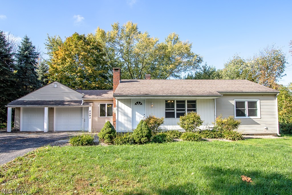 Ready to Move In to this Updated Ranch on an Acre lot? Eat in Kitchen with New Kraftmaid White Cabinets with gray stone back splash, gas & electric Range option. All new Flooring throughout this home. New Windows throughout, New deck overlooks the back yard. Heated workshop attached to 2 car Garage. Located within minutes to  several Lake Metroparks.