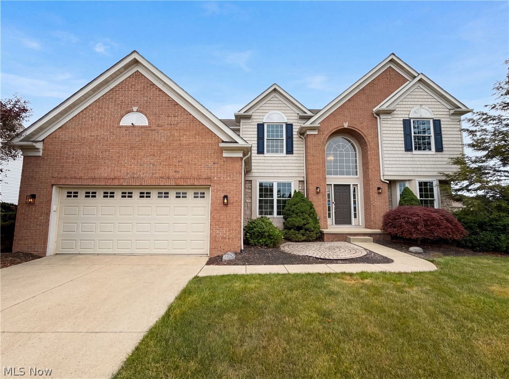 9660 Kingston Trl is a 2-story Olmsted Township single-family home built in 2005, offering 4 bedrooms and 2 bathrooms across 4,178 square feet. The kitchen features wood cabinetry, dark countertops, and stainless steel appliances including a refrigerator, range, and dishwasher. The main level includes a living area with a gas fireplace, hardwood floors, and a sunroom with water views. Upper-level bedrooms include carpet and ample closet space, and the primary bathroom features a double vanity. A finished lower level provides additional living space, and the backyard deck overlooks a pond, completing this well-maintained residence with a 2-car garage.. Included 100-Day Home Warranty with buyer activation