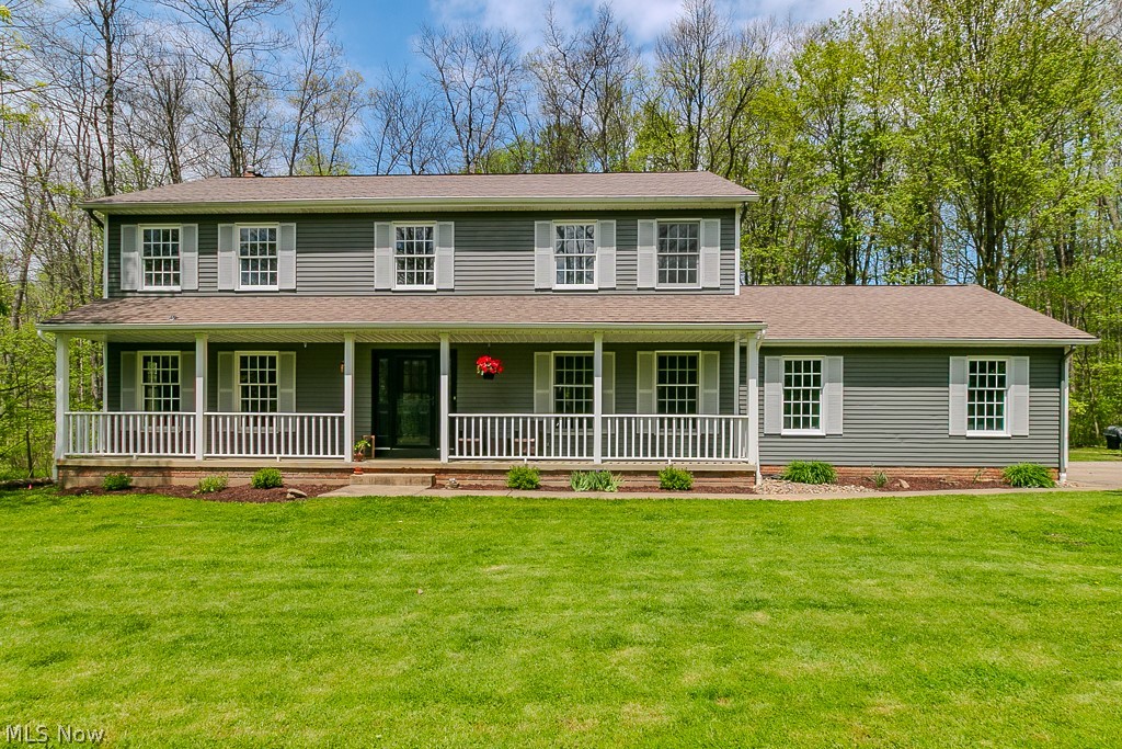 Visit this wonderful colonial nestled on a beautiful cul de sac lot, so close to downtown Chagrin Falls. Step onto the welcoming front porch & into the vaulted foyer area. The warm hickory HDWD floors lead into the formal dining room which is currently being used as an office and through the beautifully remodeled eatin kitchen. All stainless appliances, granite counters , richly colored cabinetry & a breakfast bar complete the heart of the home. Gather around a spacious table in the breakfast area & enjoy the view from the bay window. This opens to a cozy Family room with a WBFP & slider to the deck & patio with a fire pit. A front living room , 1st floor laundry & half bath complete the main floor. On the second floor there is a spacious primary bedroom with vaulted ceilings &an ensuite bath w/ soaking tub & shower. A full bath with tub shower is shared by three other generous size bedrooms with lots of closet space in each room. The lower level provides a wide open space that can be finished to your liking & a huge storage area with wooden shelving. The home is surrounded by lovely mature trees & landscaping and has a huge yard for gardens and more.  Come home to the country close to highways & all historic Chagrin Falls has to offer.