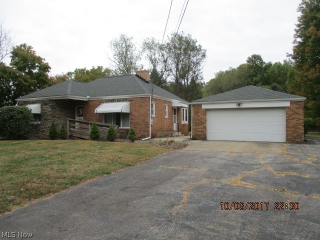 Bungalow on a level Lot. 2 Full Bedrooms and a smaller room could be used as an office or sitting room. Family room in the basement. The family room has paneling on the exterior walls. A Garage with overhead doors in the front and the back of the garage. The roof is approximately 3 years old. The well was drilled approximately 3 years ago, with a new well pump. The property is in need of much updating.