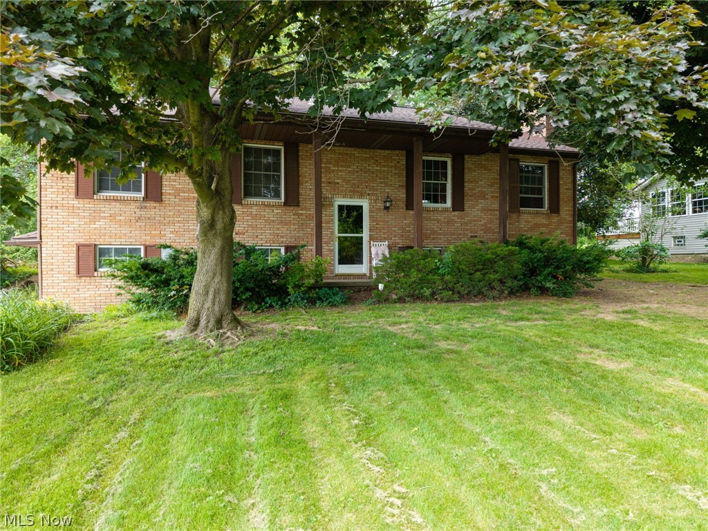 Tucked beneath a canopy of mature trees on a beautifully wooded lot, this spacious 3-bedroom, 2-bath brick split-level offers the perfect blend of privacy, comfort, and opportunity. With nearly 2,000 square feet of living space, this well-maintained home is packed with character, generous room sizes, and a setting that's hard to find.
Step inside to bright, inviting living and dining areas filled with natural light and seamless access to the rear deck—perfect for morning coffee, summer cookouts, or simply soaking in the peaceful backyard views. The spacious kitchen offers abundant cabinetry, generous counter space, a cozy breakfast nook, and plenty of storage for everyday convenience.
The lower-level family room steals the show with its stunning floor-to-ceiling brick fireplace, creating a warm and welcoming space for gatherings, movie nights, or relaxing after a long day. Upstairs, you'll find generously sized bedrooms, including a spacious primary suite featuring dual closets and private bath access.
Outside, nature takes center stage. Mature trees, established landscaping, and a large backyard create a private retreat with endless possibilities for entertaining, gardening, or simply enjoying the outdoors. An attached garage, solid brick construction, and exceptional curb appeal add even more value.
Move right in and enjoy as-is, or bring your vision and make it your own—either way, this is a rare opportunity to own a home with great bones, incredible space, and a picturesque setting in a sought-after neighborhood. Schedule your private showing today before someone else claims this hidden gem.