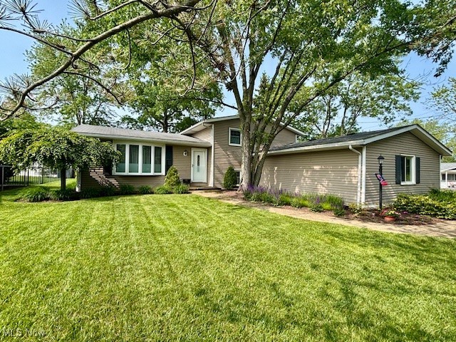 Lovingly maintained and thoughtfully updated over the past two decades, this stunning home reflects true pride of ownership—no corners skipped, no costs cut. Featuring 3 bedrooms and 1.5 bathrooms, every inch has been carefully curated with quality in mind.  

The main level showcases beautiful ¾" oak hardwood flooring that flows seamlessly into the upper level and bedrooms. Solid oak interior doors and elegant oak French door add warmth and character throughout. A custom-designed kitchen features a large eat-in island, stainless steel appliances, and flows into an open-concept living and dining room—perfect for everyday needs and entertaining.  The sunroom is a standout space, filled with natural light from skylights and a Pella sliding door, offering a tranquil retreat year-round — and with its serene ambiance, it could also serve as a versatile and inspiring home office.

Upstairs, you'll find three generously sized bedrooms and an updated full bath with HEATED tile floors. The lower level offers a cozy family room with a wood-burning fireplace, along with a convenient utility room, laundry, and half bath.

Step outside to an entertainer’s dream: an extensive outdoor living space including a deck, patio, built-in gas firepit, lush landscaping, and Kichler landscape lighting. Updates are too numerous to list—this is truly a must-see property.